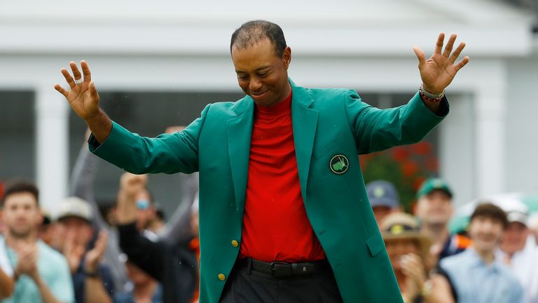 AP - Tiger Woods smiles as he wears his green jacket after winning the Masters golf tournament Sunday, April 14, 2019, in Augusta, Ga. (AP Photo/Matt Slocum)