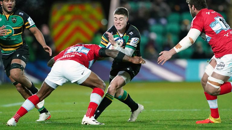 Northampton's Tommy Freeman runs at the Racing defence