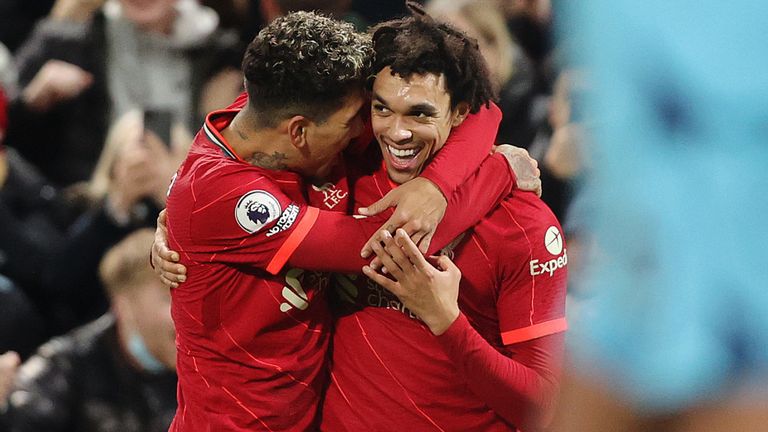 Trent Alexander-Arnold celebrates with Roberto Firmino after scoring Liverpool's third goal