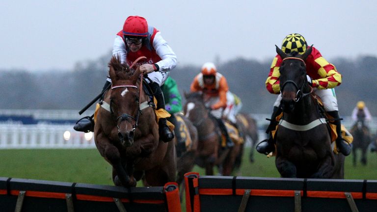 Tritonic (left) clears the last at Ascot in front of Onemorefortheroad