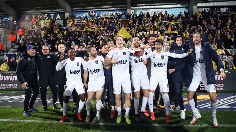 Players of the newly-promoted Belgian club Union Saint-Gilloise celebrate