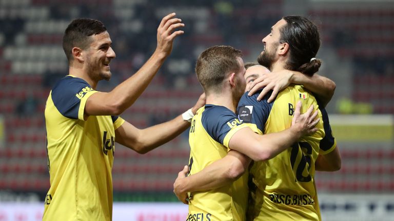 Union Saint-Gilloise players celebrate. The club is back in the top division in Belgium and lead the way at the top of the table.