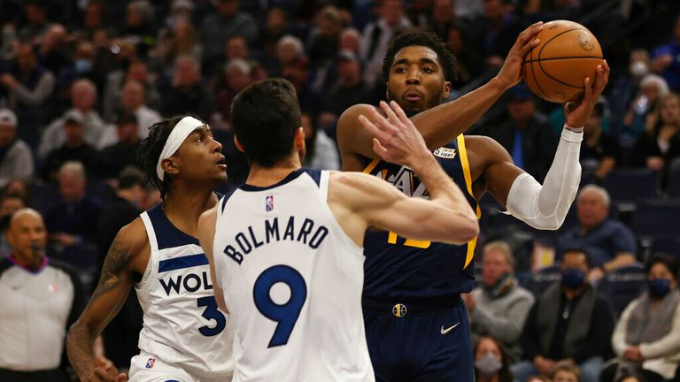 Utah Jazz guard Donovan Mitchell (45) handles the ball during the second half of an NBA basketball game against the Minnesota Timberwolves, Wednesday Dec. 8, 2021, in Minneapolis. Utah won 136-104. (AP Photo/Stacy Bengs)