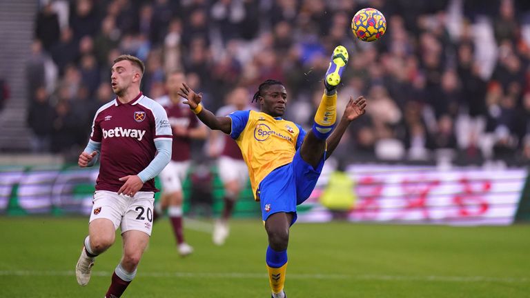 Mohammed Salisu hooks the ball to safety