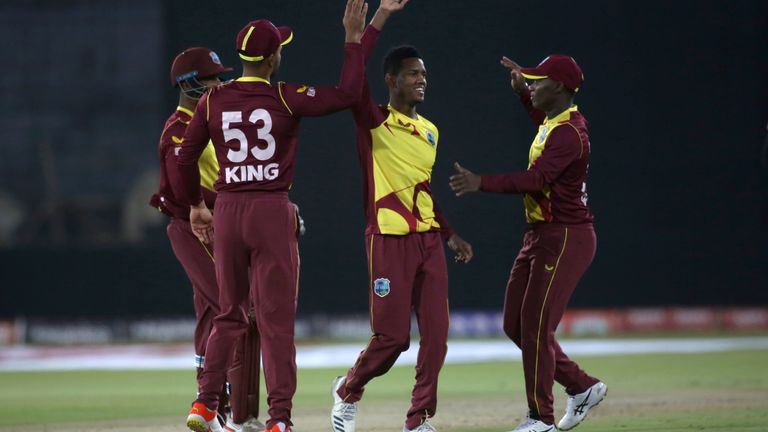 Akeal Hosein, centre, is one of the three latest West Indies players to test positive for Covid-19
