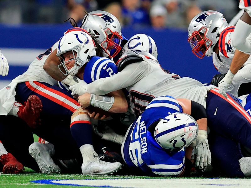 INDIANAPOLIS, IN - DECEMBER 18: Indianapolis Colts Linebacker Jordan  Glasgow (59) walks off the field at the conclusion of the NFL football game  between the New England Patriots and the Indianapolis Colts