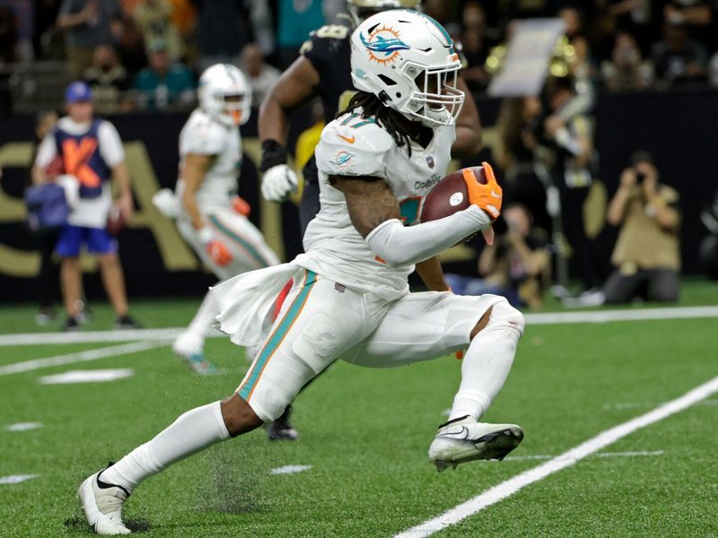 Miami Dolphins wide receiver Jaylen Waddle (17) warms up on the field  before an NFL football game against the Buffalo Bills, Sunday, Sept. 19,  2021, in Miami Gardens, Fla. (AP Photo/Doug Murray