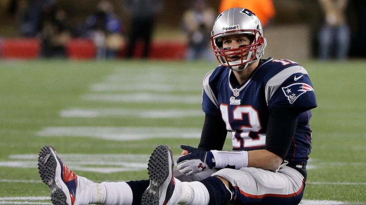 New England Patriots quarterback Tom Brady  sits on the field after getting hit during the second half of the NFL football AFC Championship football game against the Baltimore Ravens in Foxborough, Mass., Sunday, Jan. 20, 2013. (AP Photo/Steven Senne)
