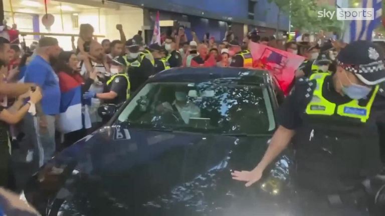 Fans outside the courthouse mobbed a car believed to be carrying Djokovic