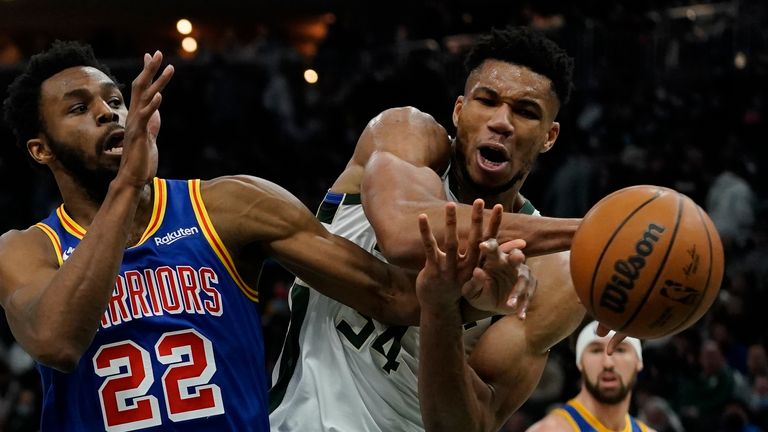 Milwaukee Bucks&#39; Giannis Antetokounmpo is fouled by Golden State Warriors&#39; Andrew Wiggins during the second half of an NBA basketball game Thursday, Jan. 13, 2022, in Milwaukee. 