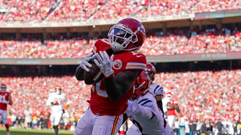 Kansas City Chiefs wide receiver Tyreek Hill (10) catches a 10-yard touchdown pass during the first half of the AFC championship NFL football game against the Cincinnati Bengals, Sunday, Jan. 30, 2022, in Kansas City, Mo. (AP Photo/Ed Zurga)
