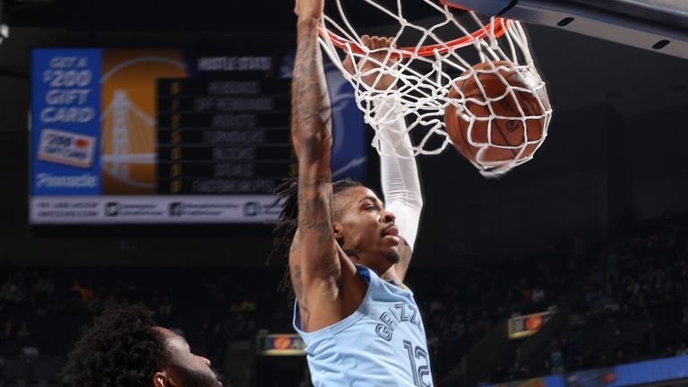 Ja Morant #12 of the Memphis Grizzlies dunks the ball against the Golden State Warriors on January 11, 2022 at FedExForum in Memphis, Tennessee. 