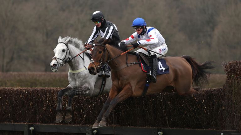 Brendan Powell riding War Lord (left) on their way to winning the Cazoo Novices&#39; Chase