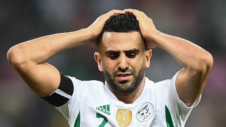 Algeria's forward Riyad Mahrez reacts after Algeria missed a free kick during the Group E Africa Cup of Nations (CAN) 2021 football match between Algeria and Equatorial Guinea at Stade de Japoma in Douala on January 16, 2022. (Photo by CHARLY TRIBALLEAU / AFP) (Photo by CHARLY TRIBALLEAU/AFP via Getty Images)