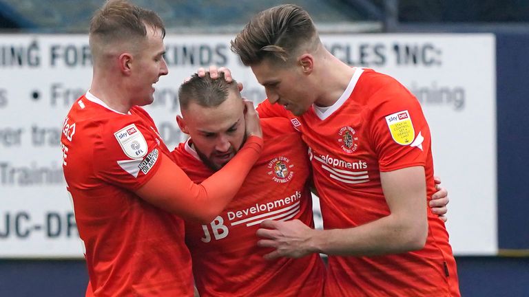 Allan Campbell is congratulated by his team-mates after putting Luton 2-0 up against Bournemouth