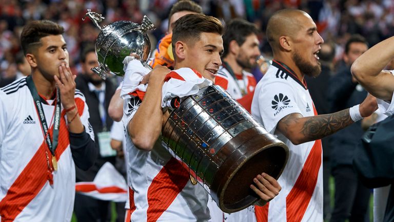 Julian Alvarez celebrates with the Copa Libertadores trophy
