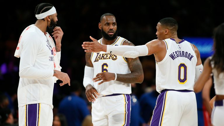 Los Angeles Lakers players Anthony Davis, LeBron James and Russell Westbrook during a timeout against the Detroit Pistons