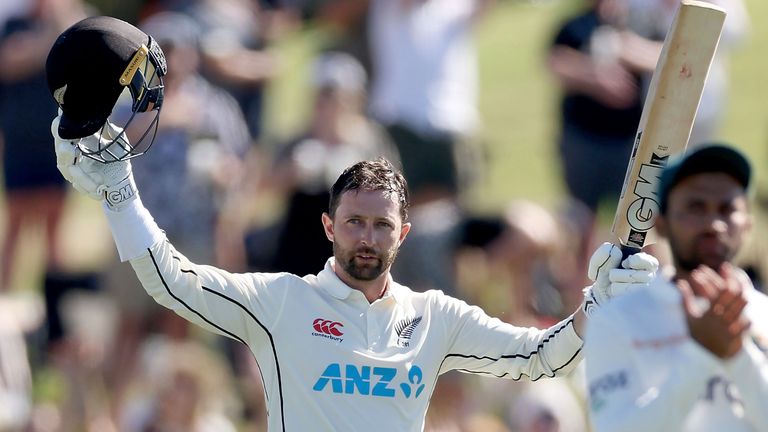 Devon Conway of New Zealand celebrates his centruy during play on day one of the first cricket test between Bangladesh and New Zealand at Bay Oval in Mount Maunganui, New Zealand, Saturday, Jan. 1, 2022. (Marty Melville/Photosport via AP)