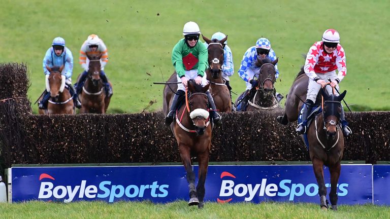 Ballyshannon Rose and Jack Kennedy (left) land over the final fence at Thurles to win from Jeremys Flame
