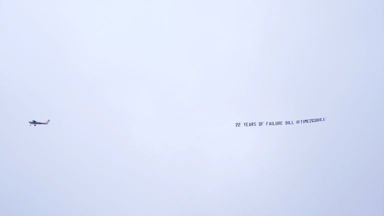 A plane with the message "22 years of failure, Bill" on Saturday