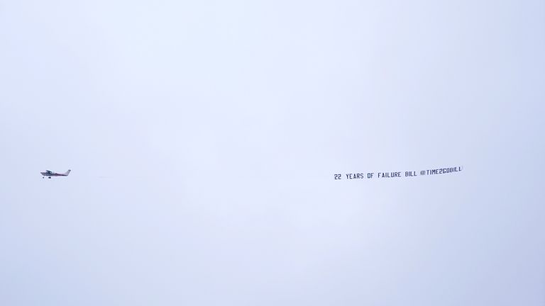 A plane with the message "22 years of failure, Bill