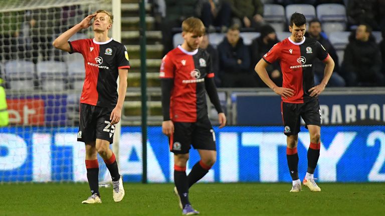 WIGAN, ENGLAND - JANUARY 08: Dejected Blackburn Rovers players during the Emirates FA Cup Third Round match between Wigan Athletic and Blackburn Rovers at DW Stadium on January 8, 2022 in Wigan, England. (Photo by Dave Howarth - CameraSport via Getty Images)                                                                                                                        