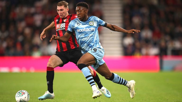 Bournemouth's Jack Stacey (left) and Forest Green Rovers' Ebou Adams (right) battle for the ball during the Carabao Cup Second Round match at the Vitality Stadium, Bournemouth. PRESS ASSOCIATION Photo. Picture date: Wednesday August 28, 2019.