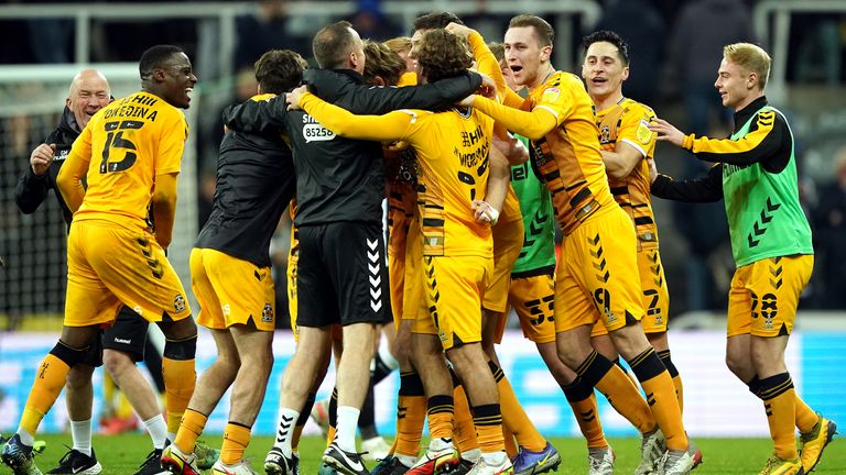 Cambridge United celebrate the 1-0 win over Newcastle at the final whistle