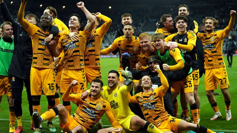 Cambridge United celebrate after knocking Newcastle United out of the FA Cup