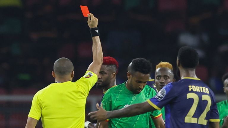 Ethiopia's defender Yared Bayeh (2nd L) reacts while receiving a red card from the referee during the Group A Africa Cup of Nations (CAN) 2021 football match between Ethiopia and Cape Verde at Stade d'Olembé in Yaounde on January 9, 2022. (Photo by Kenzo Tribouillard / AFP) (Photo by KENZO TRIBOUILLARD/AFP via Getty Images)
