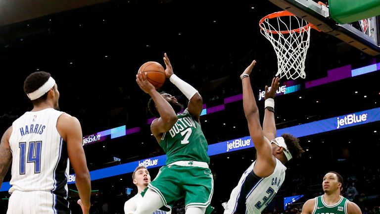 Boston Celtics guard Jaylen Brown drives the basket against Orlando Magic center Wendell Carter Jr.