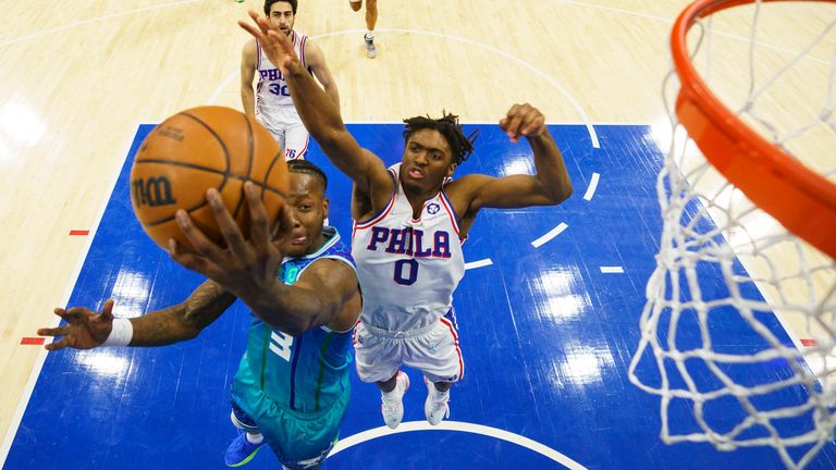 Charlotte Hornets&#39; Terry Rozier goes up for the shot as Philadelphia 76ers&#39; Tyrese Maxey comes up from behind
