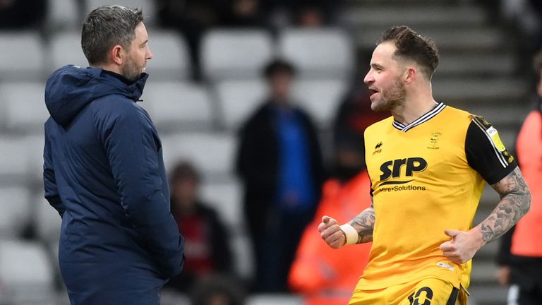 Chris Maguire celebrates his opening goal in front of Sunderland manager Lee Johnson