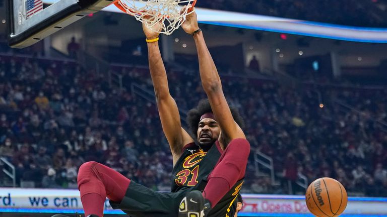Cleveland Cavaliers&#39; Jarrett Allen dunks the ball against the Oklahoma City Thunder in the first half of an NBA basketball game, Saturday, Jan. 22, 2022, in Cleveland. (AP Photo/Tony Dejak)