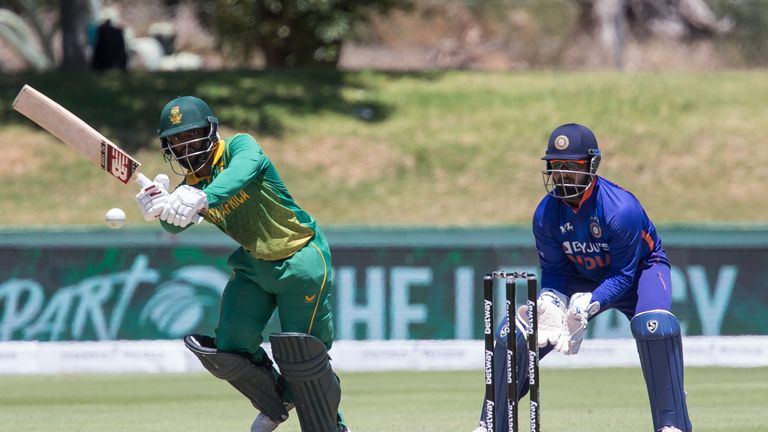 South African captain Temba Bavuma plays a shot while Rishabh Pant looks on during the first ODI match between South Africa and India in Paarl, South Africa, Wednesday, Jan. 19, 2022. (AP Photo/Halden Krog)


