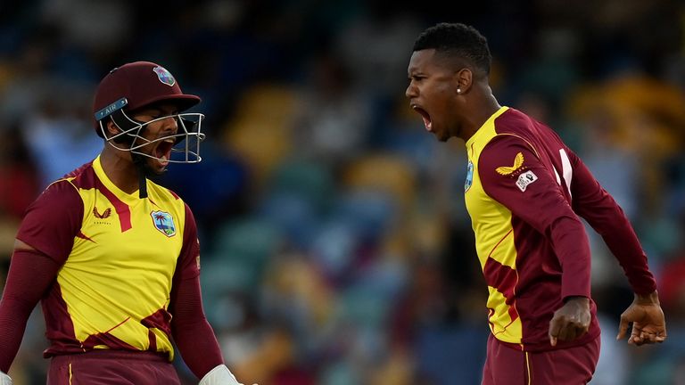 West Indies' Akeal Hosein (R) celebrates an England wicket with Nicholas Pooran in the fifth T20I (Getty Images)