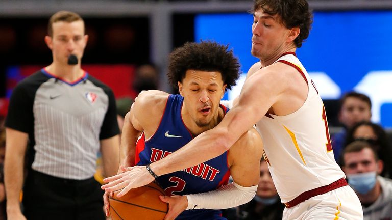 Cleveland Cavaliers forward Cedi Osman pressures Detroit Pistons guard Cade Cunningham during the second half of an NBA basketball game Sunday, Jan. 30, 2022, in Detroit. 