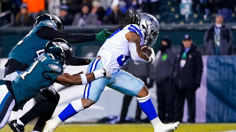 Dallas Cowboys running back JaQuan Hardy, right, scores a touchdown past Philadelphia Eagles safety K&#39;Von Wallace, left, and safety Jared Mayden, second left, during the second half of an NFL football game, Saturday, Jan. 8, 2022, in Philadelphia. (AP Photo/Julio Cortez)