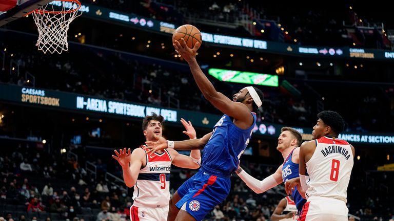Los Angeles Clippers forward Justise Winslow drives to the basket against Washington Wizards forward Deni Avdija