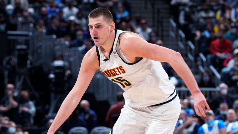 Denver Nuggets center Nikola Jokic drives past Sacramento Kings center Damian Jones.