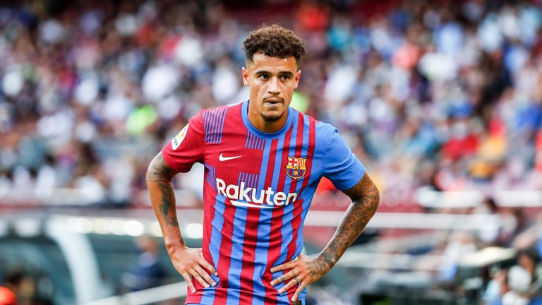 Barcelona&#39;s Philippe Coutinho runs with the ball during a Spanish La Liga soccer match between FC Barcelona and Levante at the Camp Nou stadium in Barcelona, Spain, Sunday, Sept. 26, 2021. 