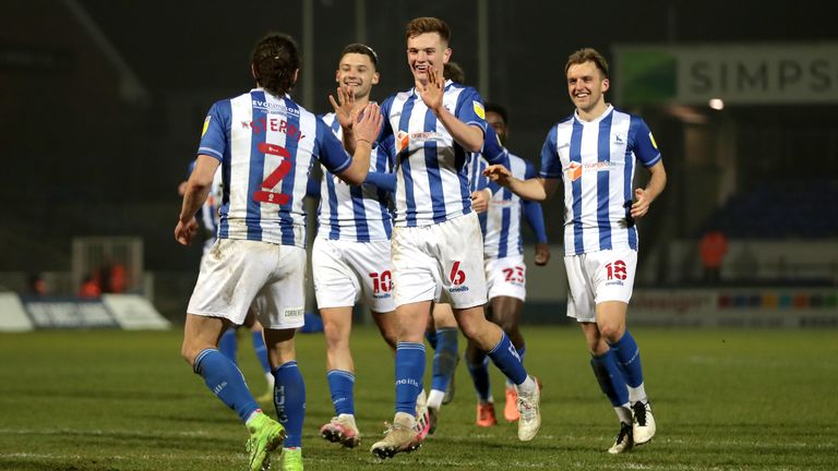 Hartlepool United&#39;s Jamie Sterry (back to camera) celebrates scoring the winning penalty during the penalty shoot-out of the Papa John&#39;s Trophy quarter-final match at Victoria Park, Hartlepool.