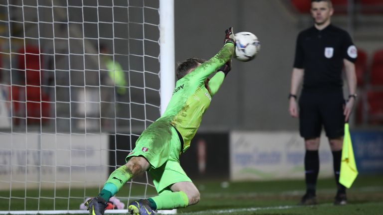 Rotherham United goalkeeper Viktor Johansson saves a penalty to win the Papa John&#39;s Trophy quarter-final match at AESSEAL New York Stadium, Rotherham.