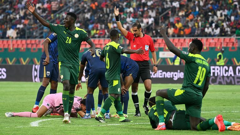 Players react after a collision during the Africa Cup of Nations 2021 round of 16 football match between Senegal and Cape Verde at Stade de Kouekong in Bafoussam on January 25, 2022.