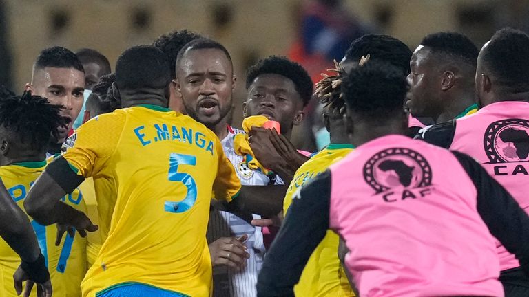A scuffle breaks out after the final whistle between Gabon and Ghana players at the end of the during the African Cup of Nations 2022 group C soccer match between Gabon and Ghana at the Ahmadou Ahidjo stadium in Yaounde, Cameroon, Friday, Jan. 14, 2022. (AP Photo/Themba Hadebe)