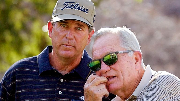 Jay Haas, left, talks to 1968 Masters champion Bob Goalby on the fifth hole at Indian Wells Country Club during the third round of the Bob Hope Chrysler Classic golf tournament Jan. 31, 2003, in Indian Wells, Calif. Goalby is also Haas' uncle.