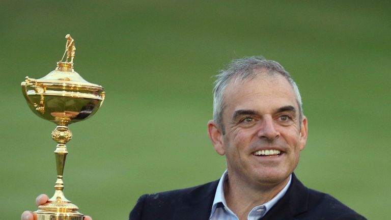Europe team captain Paul McGinley holds up the trophy after winning the 2014 Ryder Cup golf tournament at Gleneagles, Scotland, Sunday, Sept. 28, 2014. (AP Photo/Peter Morrison)