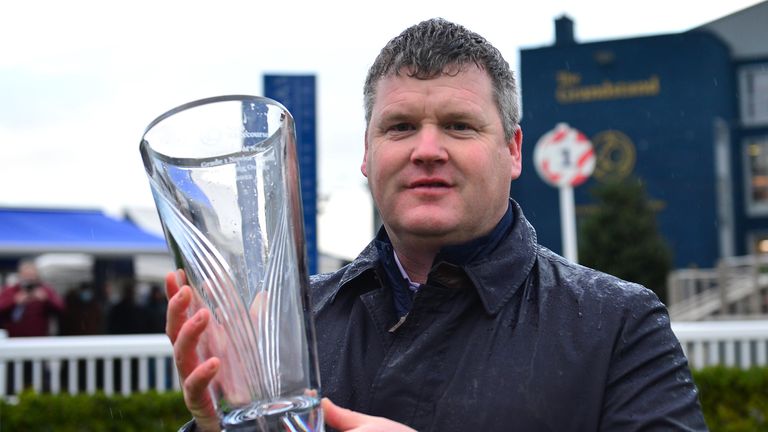 Trainer Gordon Elliott poses with the Lawlor's Of Naas trophy 