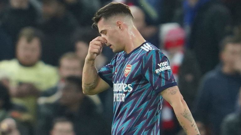 Arsenal&#39;s Granit Xhaka leaves the pitch after being sent off during the EFL Cup semifinal, first leg soccer match between Liverpool and Arsenal at the Anfield Stadium in Liverpool, Thursday, Jan.13, 2022.(AP Photo/Jon Super)