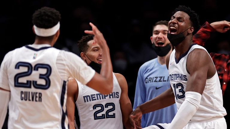 Memphis Grizzlies forward Jaren Jackson Jr.  reacts after Jarrett Culver made a three-point basket in front of Brooklyn Nets forward James Johnson